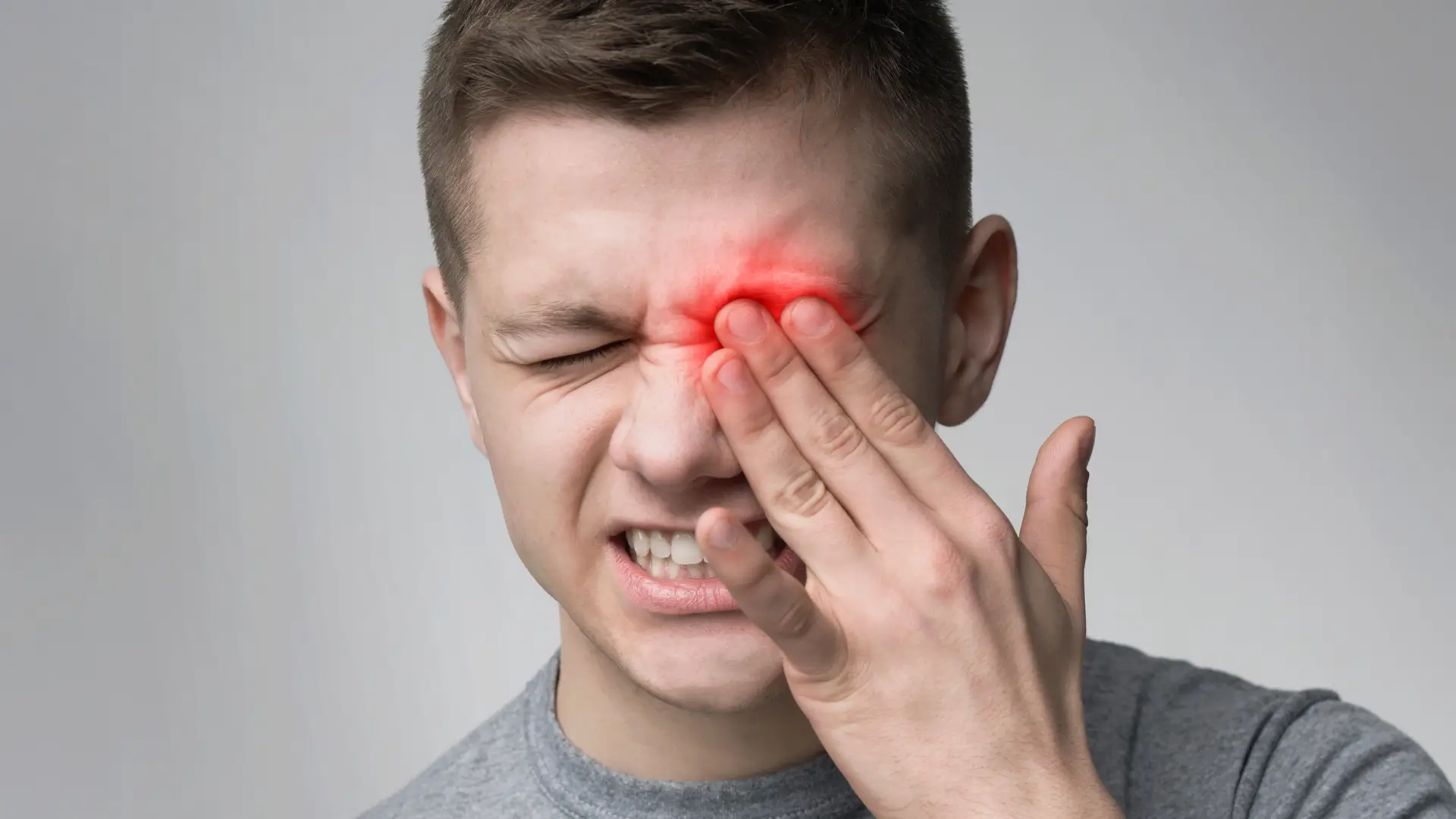 An individual dealing with eye pain.