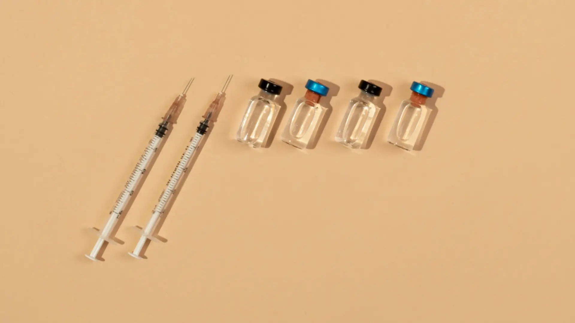 Two botox syringes and four vials.