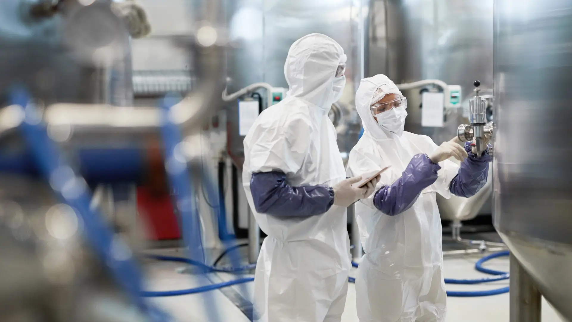 Two medical scientists working in a pharmaceutical laboratory.