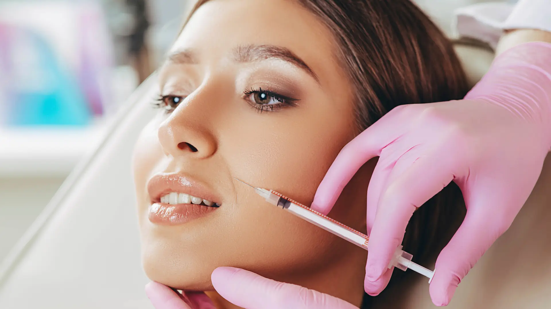An individual receiving a botox injection for their nasolabial folds.