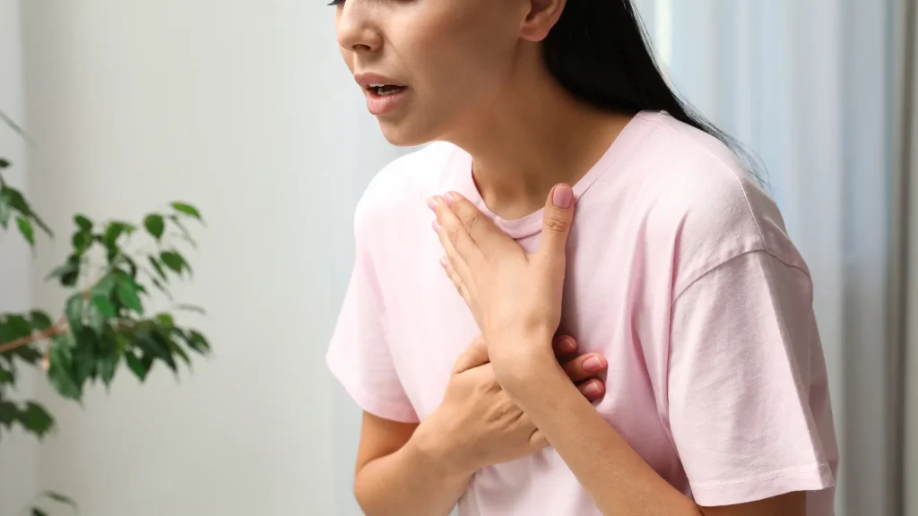 An individual facing difficulty breathing caused by anaphylaxis.
