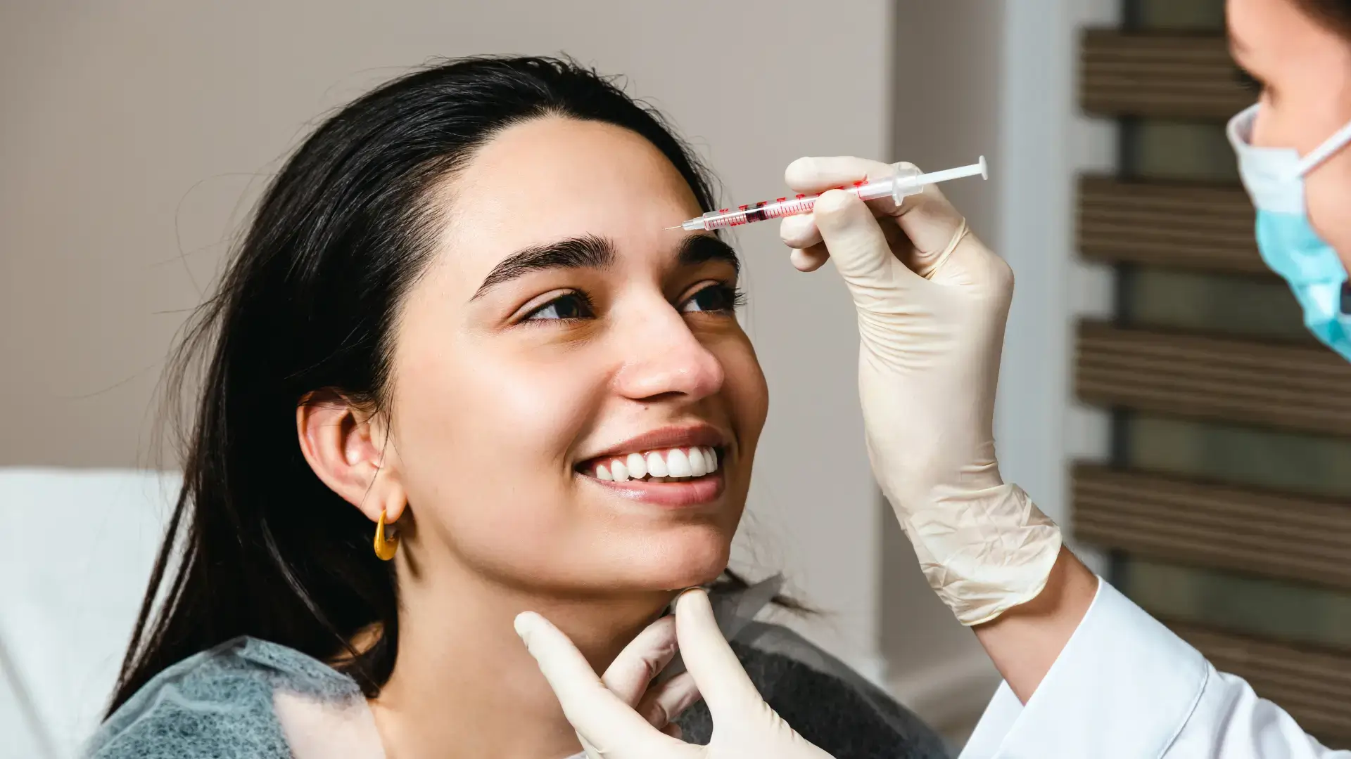 A patient receiving an injection from a licensed medical professional.