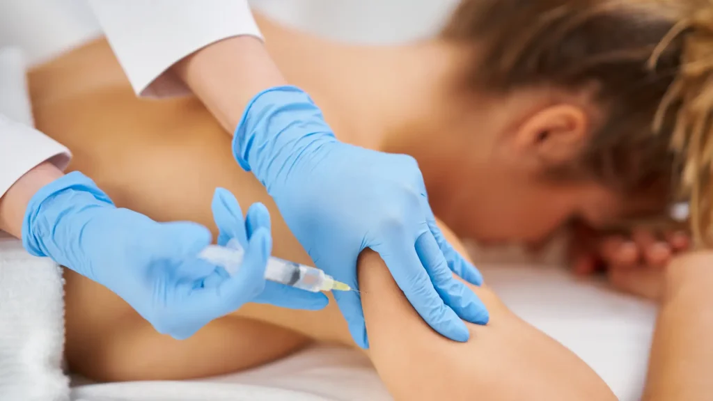 An individual undergoing fat reduction on their upper arms.