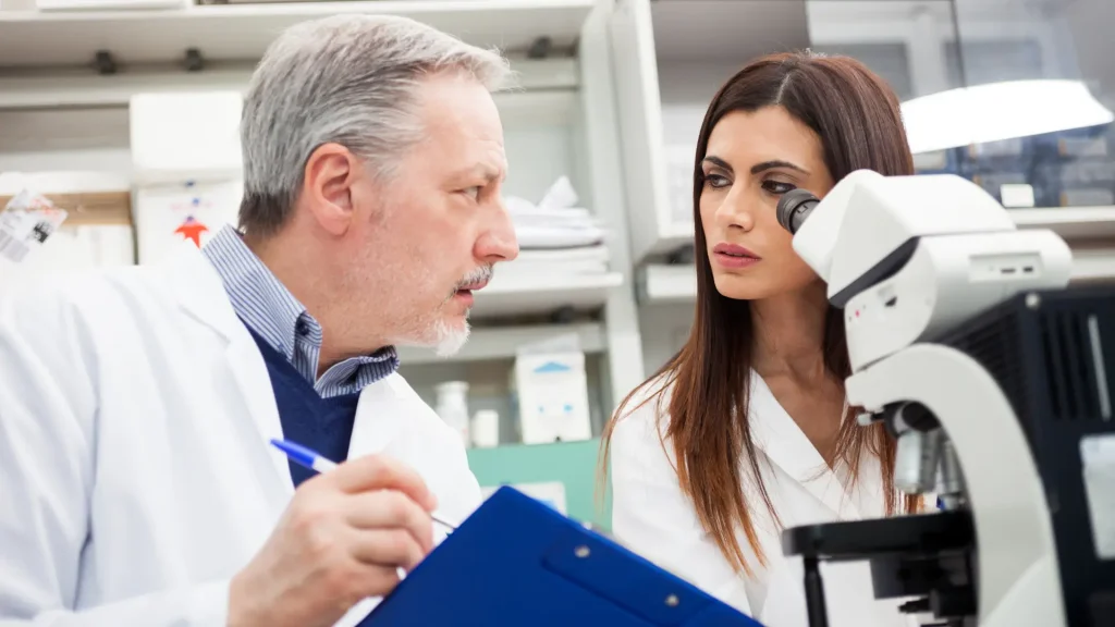 Medical scientists discussing the available data during a clinical trial.