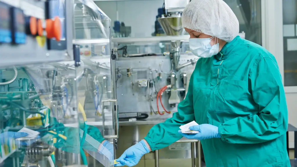A scientist working in a pharmaceutical laboratory.