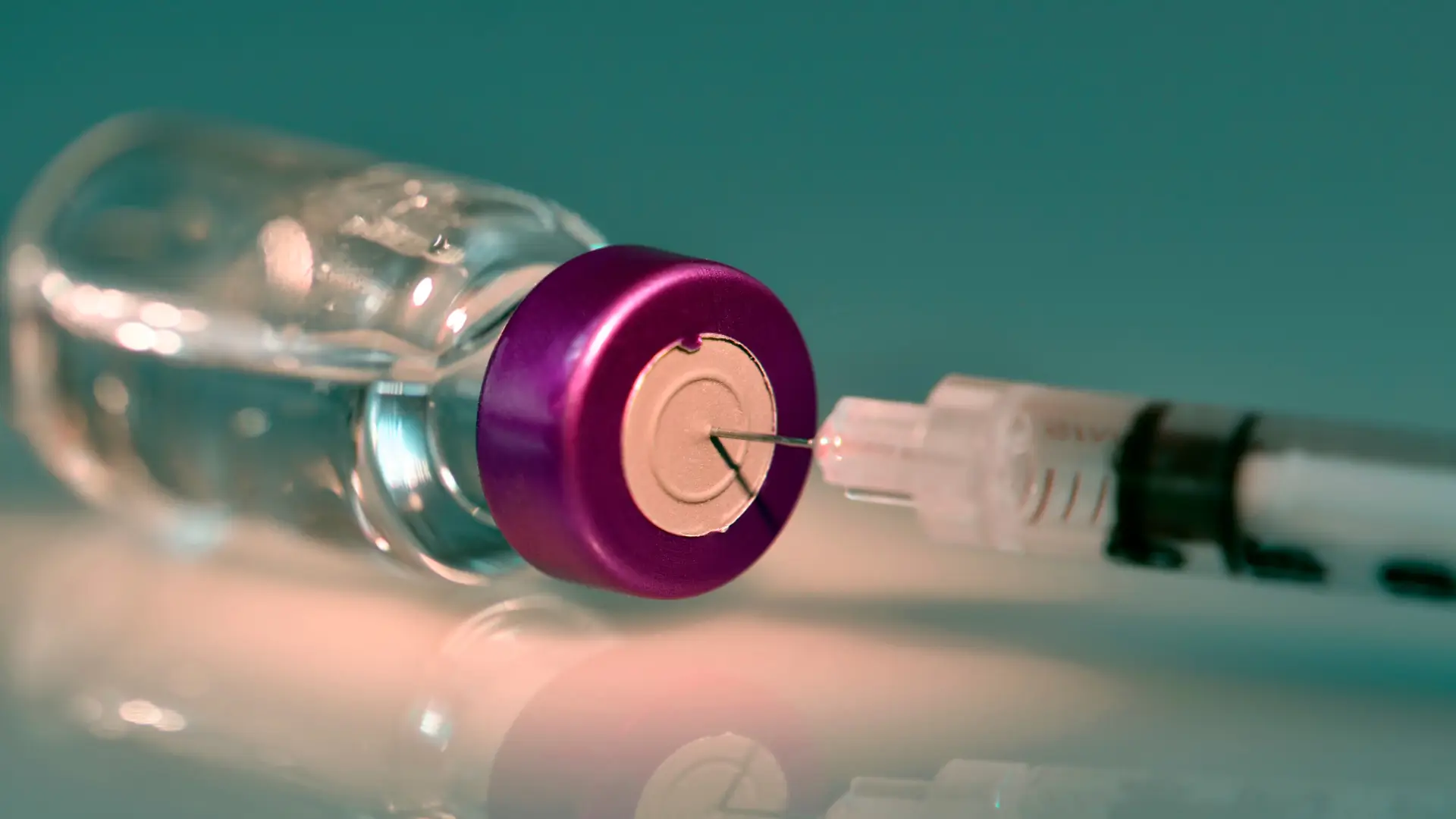 An injection syringe placed in a vial.