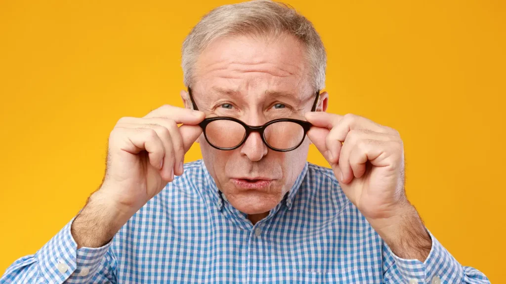 An older individual dealing with nAMD and having difficulty in seeing.