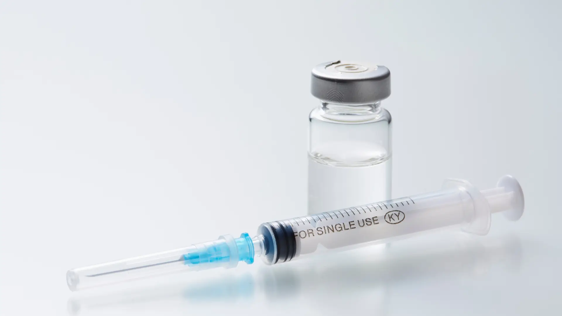 A vial and syringe.
