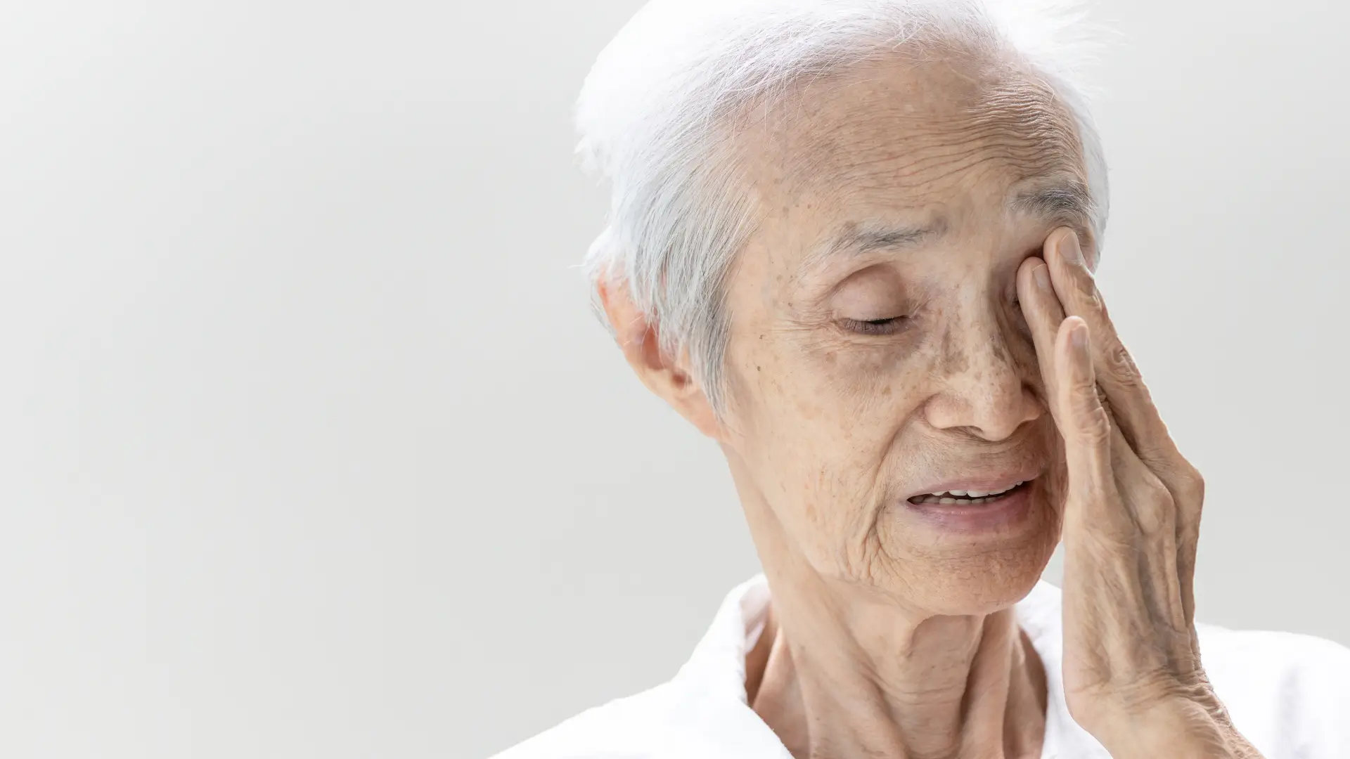 An elderly woman suffering from wet AMD.