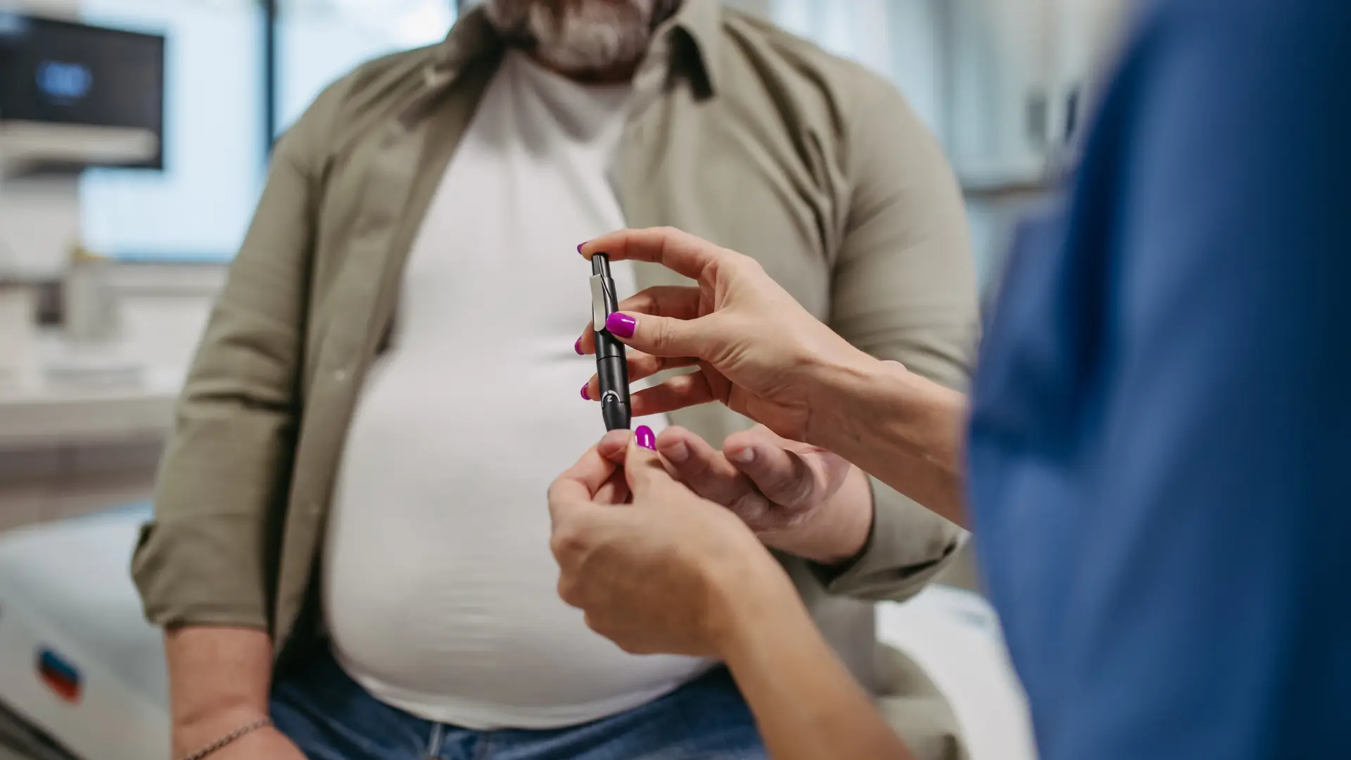 A medial professional monitoring patient's blood sugar control.
