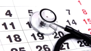 A close-up shot of a stethoscope on a calendar.