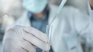 A medical scientist working on a formulation, like Mounjaro or other injectable medications.