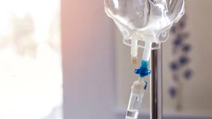 A close-up shot of an IV drip in a hospital room, similar to the infusion used in NAD IV therapy.