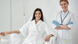 A medical professional supervising a patient's NAD IV therapy for a safe treatment.