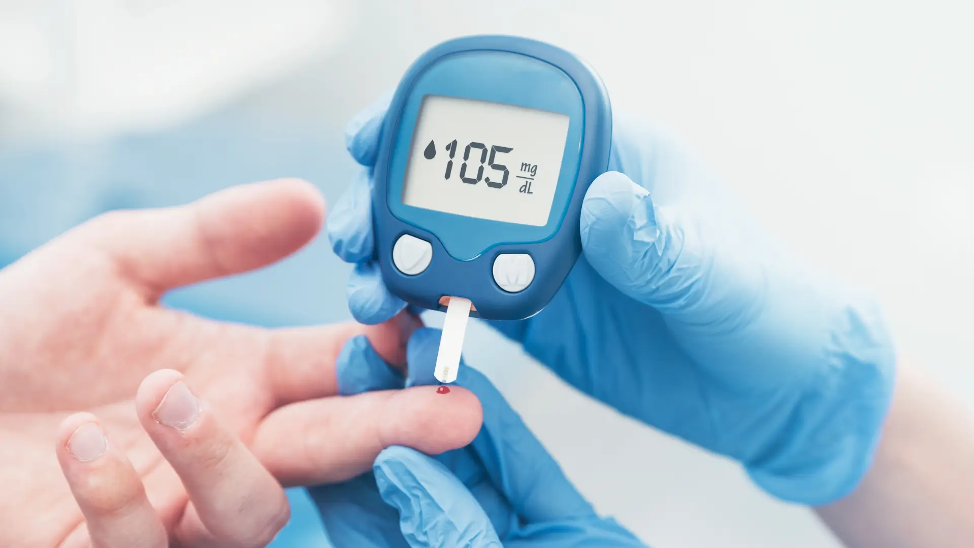 A doctor checking a patient's blood sugar to determine the most suitable glucose control treatment.