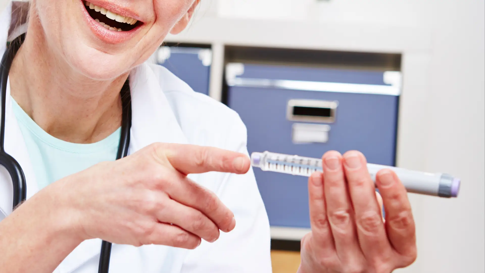A healthcare provider explaining the administration of a prefilled injection pen for type 2 diabetes, like Ozempic.