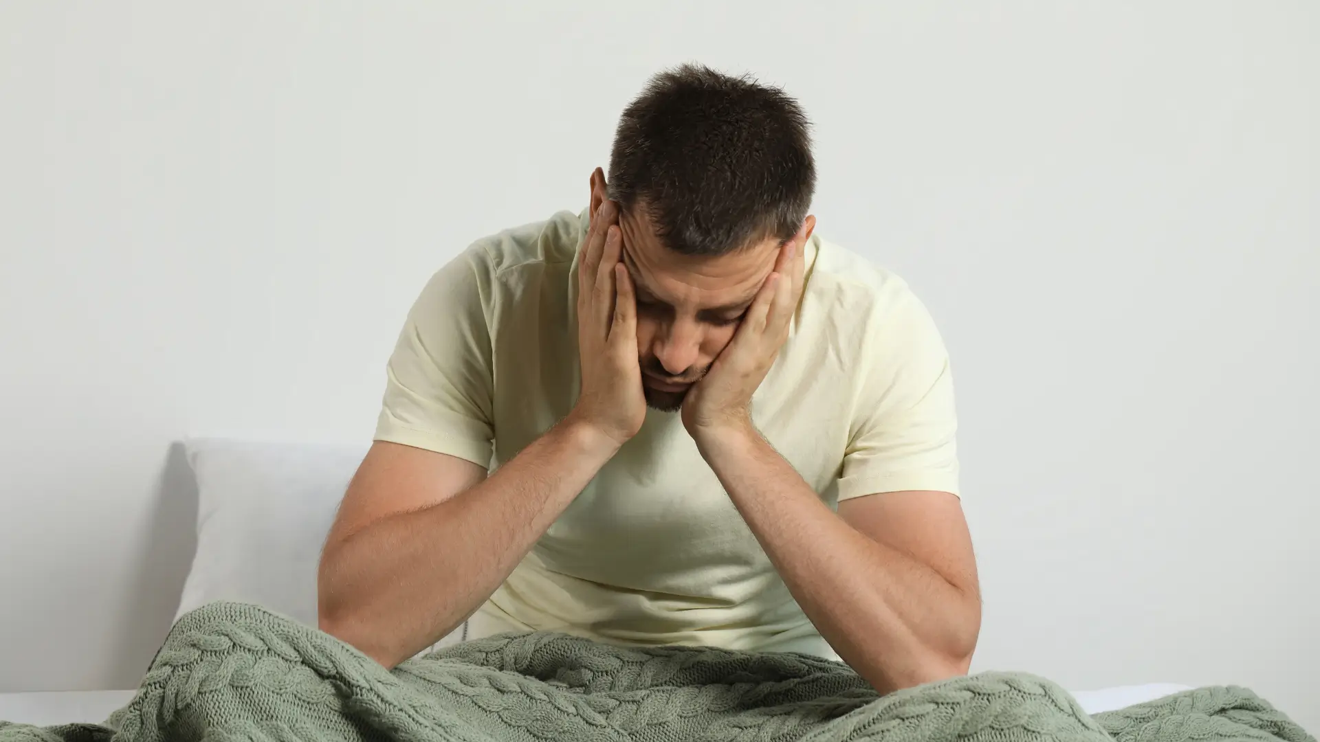 A male individual dealing with fatigue right after waking up, which is potentially a medication side effect of Ozempic.