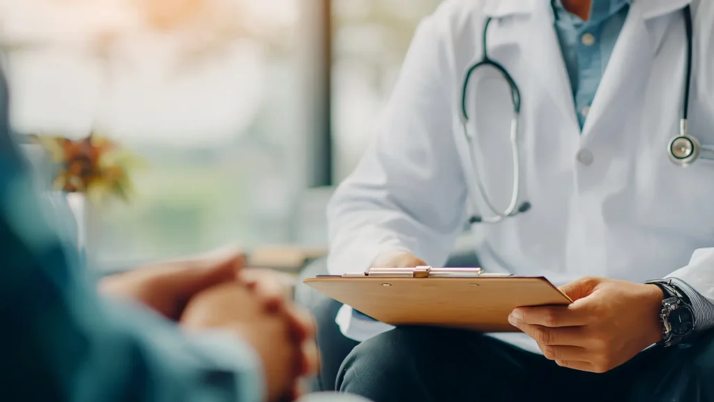 A doctor and patient consultation about their health concerns and potential treatment solution, like Xolair.