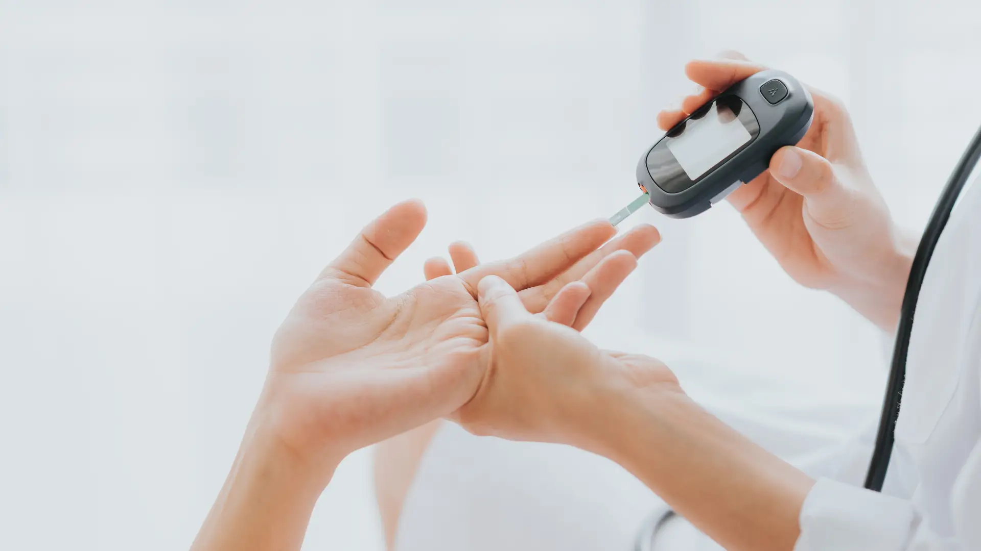 A medical professional checking a patient's glucose level using a glucometer to ensure suitability to Novo Nordisk Ozempic.