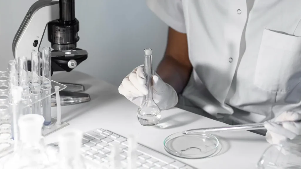 A medical scientist working with research peptide formulations, like Ipamorelin, to understand its half-life and duration of potential effects.