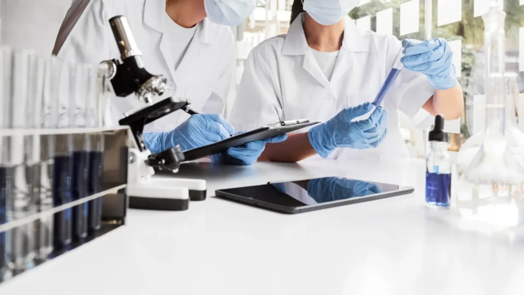 Research professionals working on various peptide formulations in a laboratory.