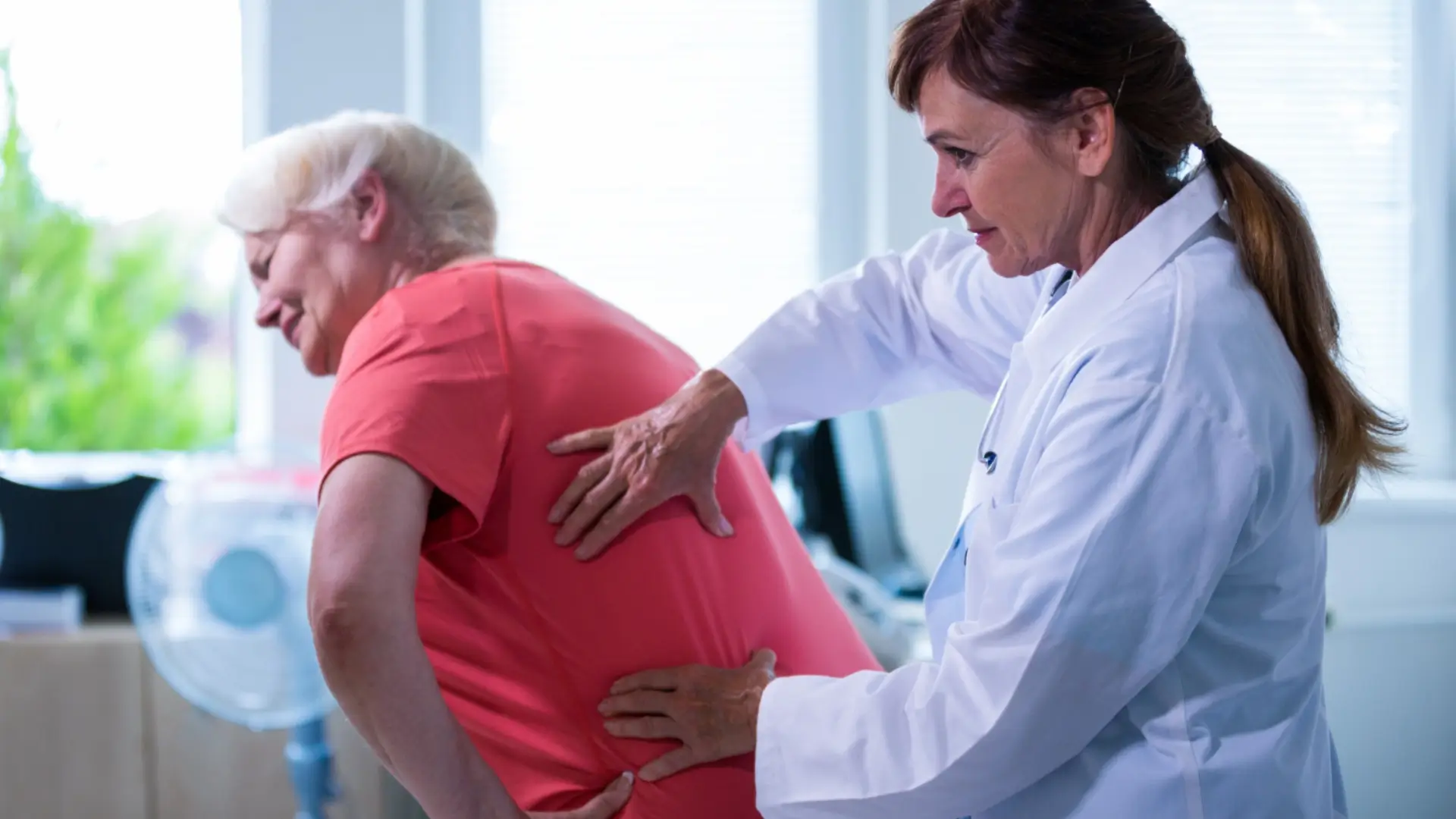 A medical professional assessing a elderly individual's condition before prescribing the best injection for osteoporosis.